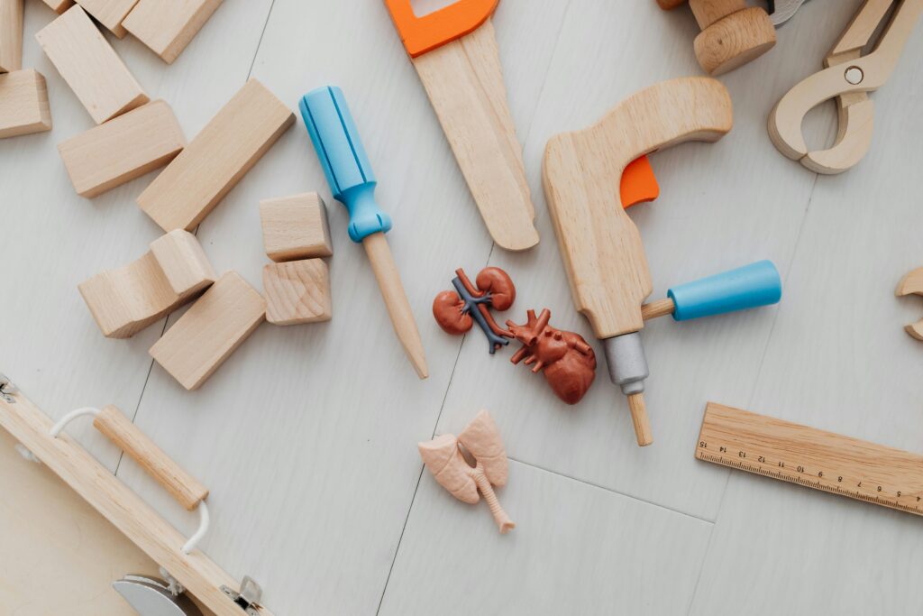 Top view of creative wooden toys and organs, perfect for educational crafts and play.